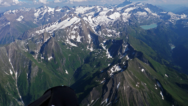 Paragliding above the main spain of the Alps at the altitude of 4000m/13.000ft in the area of Grossglockner peak (highest mountain of Austria), Hohe Tauren Alps, Austria (Jarek's 120km XC flight in Pinzgau in July 2013)