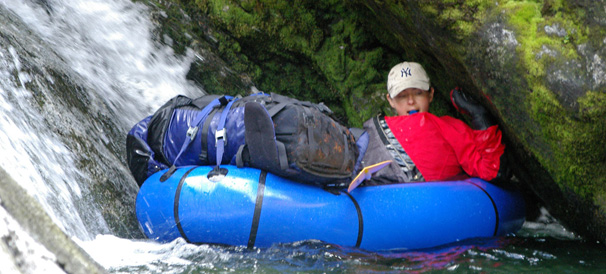 Tanking up spring water in Alpacka raft on Laguna Reicher. Ventisquero Reicher glacier lake, Northern Patagonian Icefield, Patagonia, Chile.
