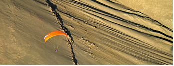Sunset paragliding at Quebrada Tiliviche, Pisagua, Chile