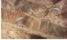 Paragliding above desert plateau of Altos de Chipana, Iquique, Atacama Desert, Chile