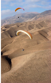 Cerro Toro - Paragliding over plateau of Cerro Torro ridge, Pisagua, Atacama Desert, Chile - Pilots: Scott Barros, USA Magdalena Pietrasiuk, Poland - Fly Atacama 2008 participant
