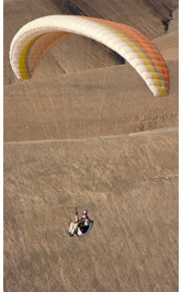 Cerro Toro - Paragliding over plateau of Cerro Torro ridge, Pisagua, Atacama Desert, Chile - Pilot: Scott Barros, USA - Fly Atacama 2008 participant