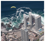 Flying a paraglider above the peninsula of Iquique, Atacama Desert, Chile