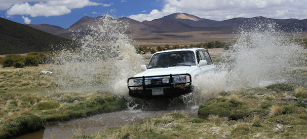 Crossing Mucomucone river between Las Vicunas Nature Reserve and Volcan Isluga National Park, Altiplano, Chile