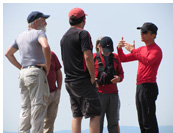 Look for thermals along the sunny side of the mountain :: Jarek giving briefing to pilots before an XC flight from Kobala, Soca valley, Julian Alps, Slovenia